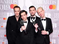 Matthew Healy, Ross MacDonald, George Daniel and Adam Hann of The 1975 with their Brit Awards (Ian West/PA)