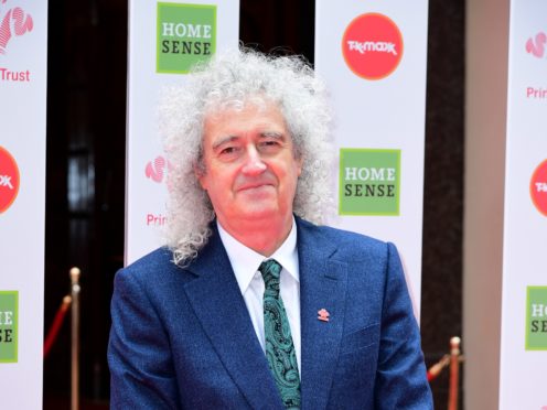 Brian May stands beside Grace the Hedgehog, mascot of the Save Me Trust (Jonathan Brady/PA)