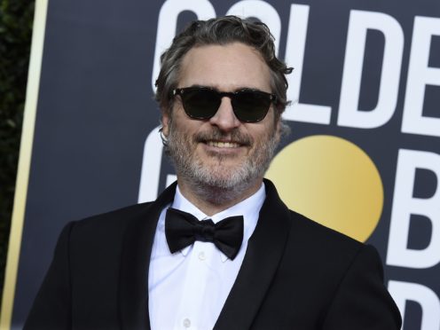 A US TV host has apologised to Joker star Joaquin Phoenix after appearing to mock a scar on his upper lip (Jordan Strauss/Invision/AP, File)