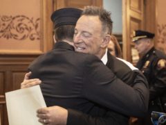 Bruce Springsteen hugs his son Sam (Jennifer Brown/Jersey City Mayor’s Office via AP)