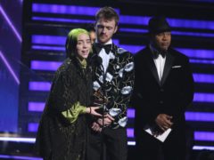 Billie Eilish, left, and Finneas O’Connell pose in the press room with the awards for best album, best engineered album and best pop vocal album for “We All Fall Asleep, Where Do We Go?,” best song and record for “Bad Guy,” best new artist and best producer, non-classical at the 62nd annual Grammy Awards at the Staples Center on Sunday, Jan. 26, 2020, in Los Angeles. (AP Photo/Chris Pizzello)