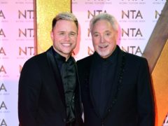 Olly Murs and Tom Jones during the National Television Awards (Ian West/PA)