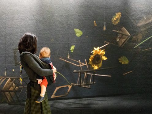 A visitor looks at an installation at the Meet Vincent Van Gogh Experience (Luciana Guerra/PA)