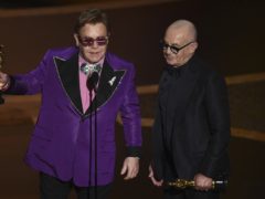 Sir Elton John paid tribute to Bernie Taupin, his song-writing partner of more than five decades, as the jubilant pair were victorious at the Oscars (AP Photo/Chris Pizzello)