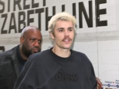 The moment Justin Bieber watched wife Hailey walk down the aisle on their wedding day has been revealed in never-before-seen footage (Yui Mok/PA)
