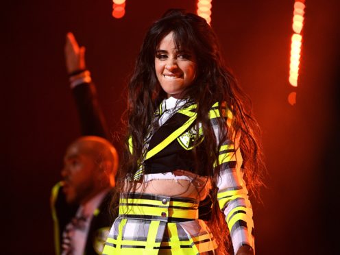 She performed in a mock school uniform (Scott Garfitt/PA)