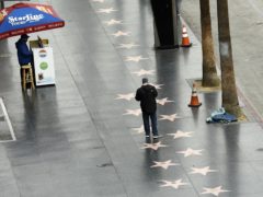The Hollywood Walk Of Fame, usually one of Los Angeles’s busiest tourist attractions, was almost empty amid the coronavirus pandemic (Chris Pizzello/AP)