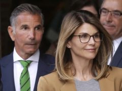 Actress Lori Loughlin and her husband, clothing designer Mossimo Giannulli, seen here at a court in Boston last year. The couple and other prominent parents have told a judge he should dismiss charges against them in the college admissions bribery case (Steven Senne/AP)