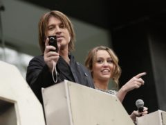 Miley and Billy Ray Cyrus starred alongside each other in Hannah Montana: The Movie (Yui Mok/PA)