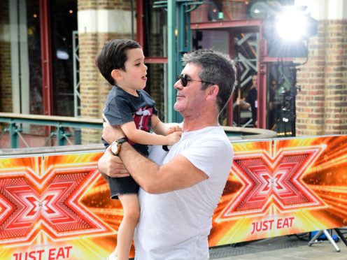 Simon Cowell and son Eric Cowell (Ian West/PA)