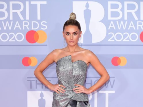 Love Island star Amber Davies revealed she is staying single after Dolly Parton warned her men could derail her career (Ian West/PA)