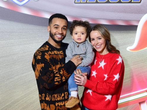 Aston Merrygold and fiancee Sarah with their son Grayson (Ian West/PA)