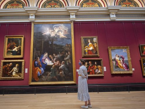 A visitor wearing PPE at the National Gallery as it prepares to reopen following the easing of coronavirus lockdown restrictions across England (Victoria Jones/PA)