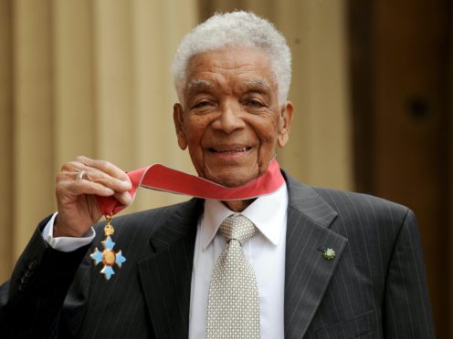 Actor Earl Cameron outside Buckingham Palace with his CBE (Anthon Devlin/PA)