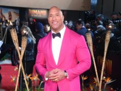 Hollywood star Dwayne “The Rock” Johnson is teaming up with his ex-wife and a sports management company to buy the XFL American football league (Matt Crossick/PA)