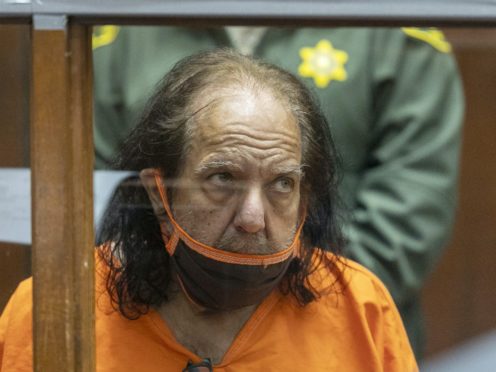 Adult film star Ron Jeremy has been charged with an additional 20 counts of sexual assault involving 13 women (David McNew/via AP)