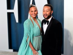 Chrissy Teigen has recalled the ‘horrifying’ moment she and husband John Legend were followed and harassed by two white men (Ian West/PA)