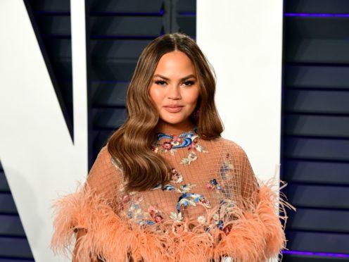 Pregnant Chrissy Teigen reassured fans she and her unborn baby are ‘completely fine’ (Ian West/PA)