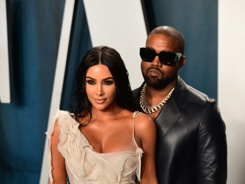 Kanye West shared a throwback picture to the night he popped the question to Kim Kardashian West as he wished his wife a happy 40th birthday (Ian West/PA)