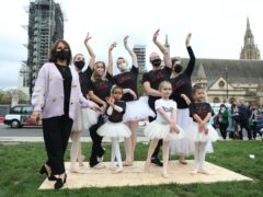 Arlene Phillips (left) joins in with a group of dancers as they perform during a protest calling for more funding for the performing arts in Parliament Square (Luciana Guerra/PA)