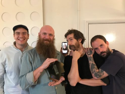 Idles have scored their first number one album (Official Charts Company/PA)