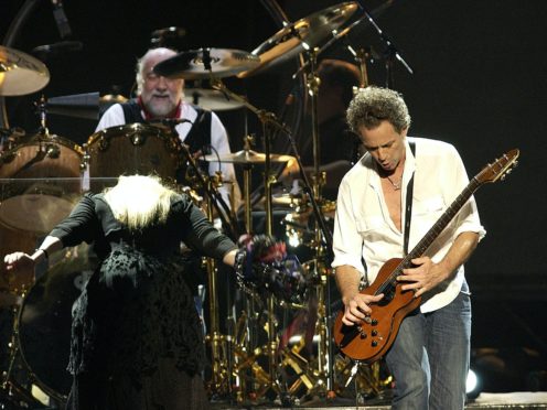 Stevie Nicks, Mick Fleetwood (on drums) and Lindsay Buckingham (PA)