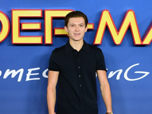 Tom Holland urged people to wear a mask as he shared a picture from the set of Spider-Man 3 (Ian West/PA)