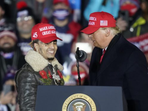 President Donald Trump brings rapper Lil Pump to the podium (Carlos Osorio/AP)