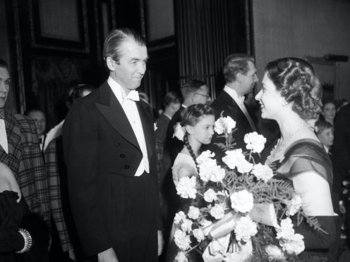 It’s A Wonderful Life starring James Stewart, pictured meeting Princess Elizabeth, was named top Christmas film (PA)