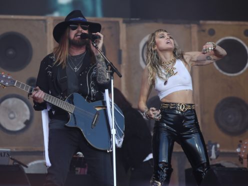 Miley Cyrus and her father Billy Ray Cyrus (Yui Mok/PA)