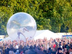 Wayne Coyne of The Flaming Lips performs inside of a giant plastic ball at Lovebox festival, east London in 2008 (Zak Hussein/PA)
