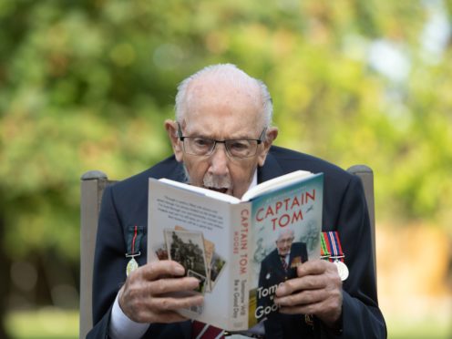 Captain Sir Tom Moore with his autobiography (Joe Giddens/PA)