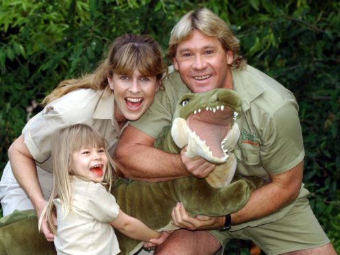 Bindi Irwin with her late father, Steve, and mother Terri at London Zoo in 2002 (Myung Jung Kim/PA)