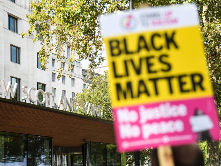 Protesters outside New Scotland Yard in London (Kirsty O’Connor/PA)