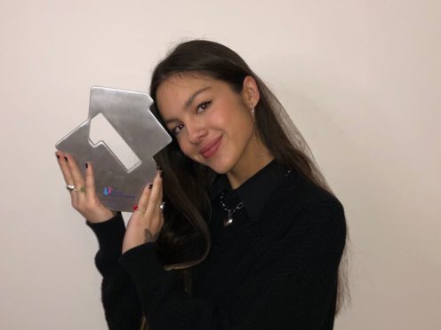 Olivia Rodrigo pictured celebrating her first week at number one in the official UK singles chart with the song Drivers License (PA)