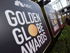 Signs above the red carpet at the Golden Globe Awards in 2020, when Britain first enjoyed a record 10 wins (Jordan Strauss/AP)