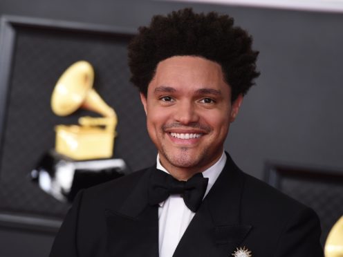 Comedian Trevor Noah opened the Grammy Awards with a joke about the royal family as Harry Styles kicked off the performances (Jordan Strauss/Invision/AP)