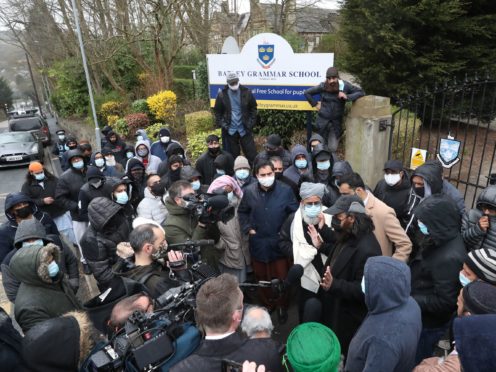 People gathered outside Batley Grammar School in Batley, West Yorkshire, for a second day of protest (Danny Lawson/PA Wire)