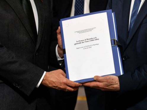 The report on France’s role in 1994’s Rwandan genocide is given by Historian and Commission chief, Vincent Duclert to French President Emmanuel Macron, at the Elysee Palace, in Paris (Ludovic Marin/AP)