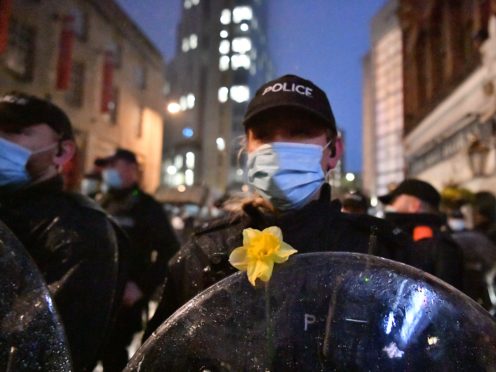 A daffodil on a police officer’s shield placed there by a protester during the ‘Kill The Bill’ protest in Bristol (Ben Birchall/PA)