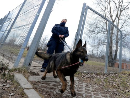 Police officer Katarzyna Matuszewska after training with a patrol dog (AP)