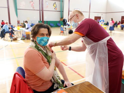 First Minister Arlene Foster receiving her first Covid-19 vaccination at Castle Park Leisure Centre in Lisnaskea, Co Fermanagh (Kelvin Boyes/Press Eye/PA)