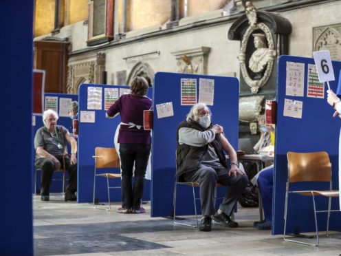 Members of the public receive an injection of the coronavirus vaccine at Salisbury Cathedral (Steve Parsons/PA)