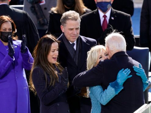Hunter Biden, centre, watches on at his father Joe’s presidential inauguration in January (Carolyn Kaster/AP)
