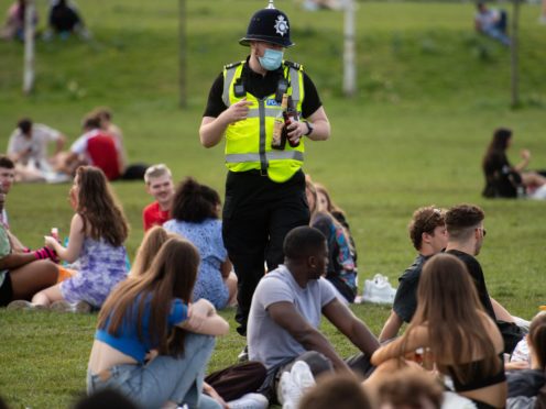 Police officers confiscate alcohol at the Forest Recreation Ground in Nottingham (Jacob King/PA)
