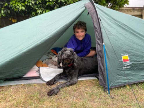 Max Woosey, 11, has spent a year camping in his garden to raise money for a hospice which looked after a family friend (Woosey family/PA)