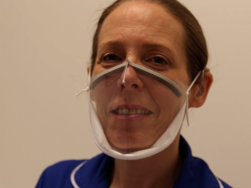 Junior Sister Emma Ayling, an accomplished lip-reader, demonstrates the new see-through mask (Cambridge University Hospitals/PA)