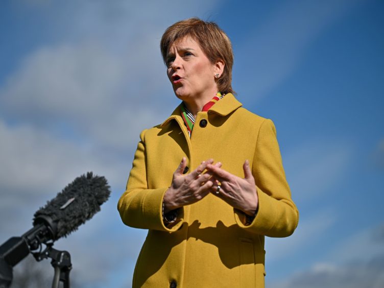 Nicola Sturgeon pledged she would not ‘pass the buck’ on tackling climate change to the younger generation (Jeff J Mitchell/PA)
