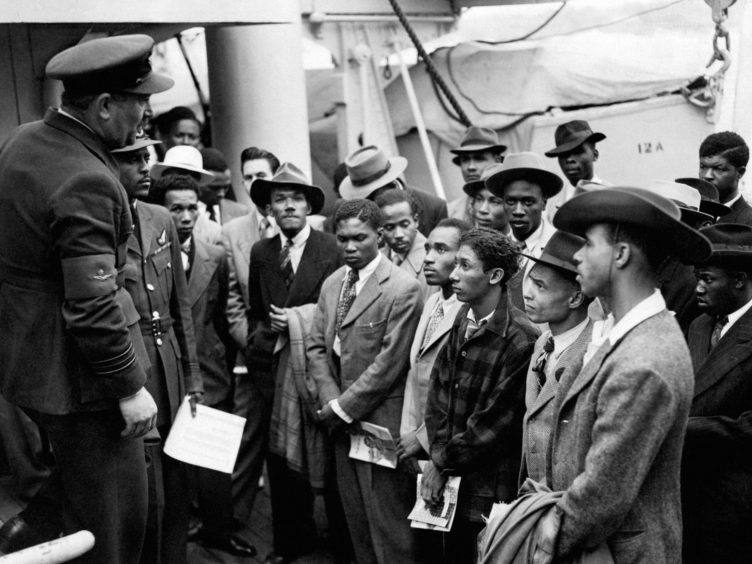 Jamaican immigrants arriving at Tilbury on the Empire Windrush (PA)