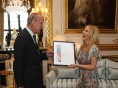 The Duke of Edinburgh with Kylie Minogue (Steve Parsons/PA)
